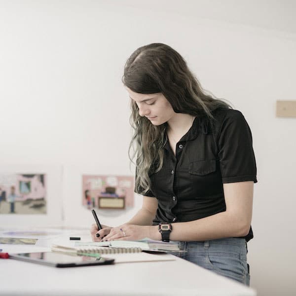 Portrait of an ArtsLab graduate sketching