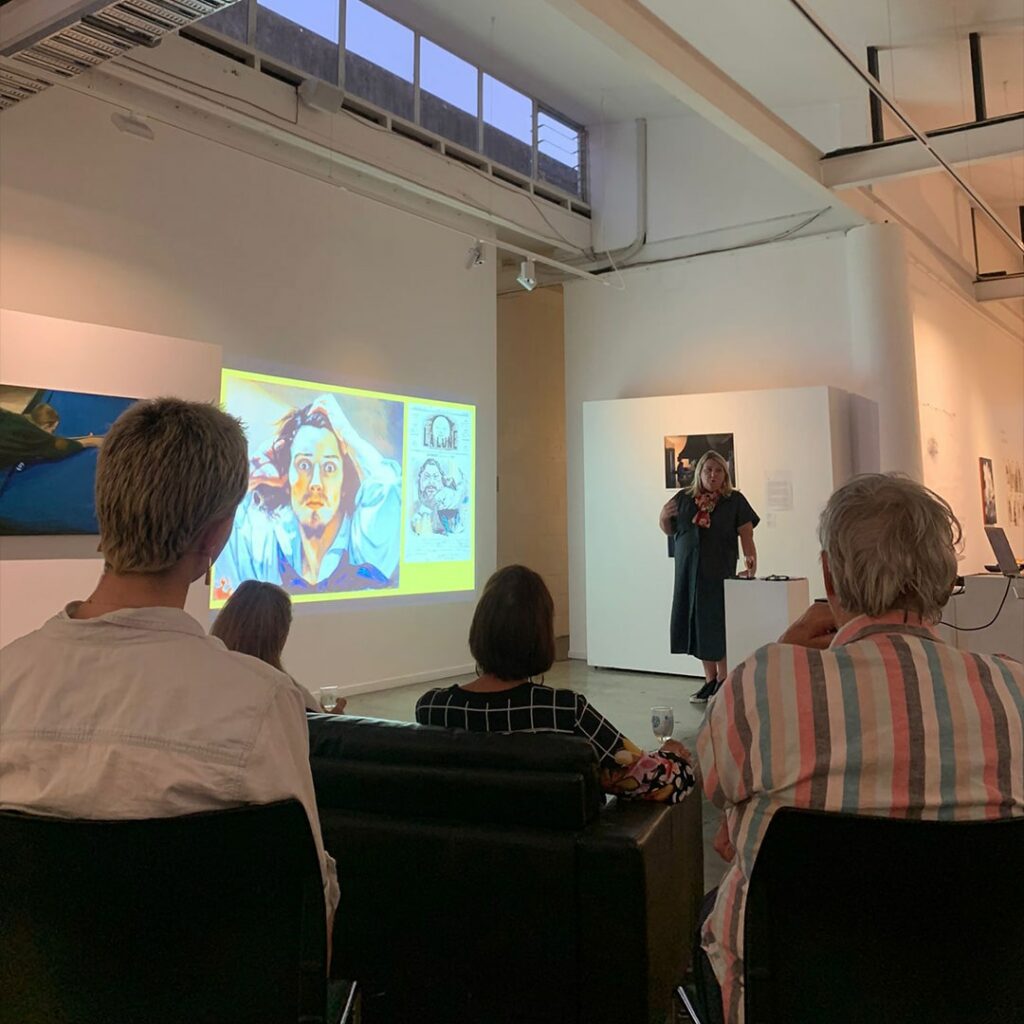 Photo of Claire Chamberlain presenting her talk at DEPOT's Light Night.