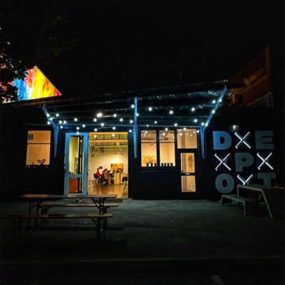 Exterior Photo Of DEPOT's Light Night Frontage.